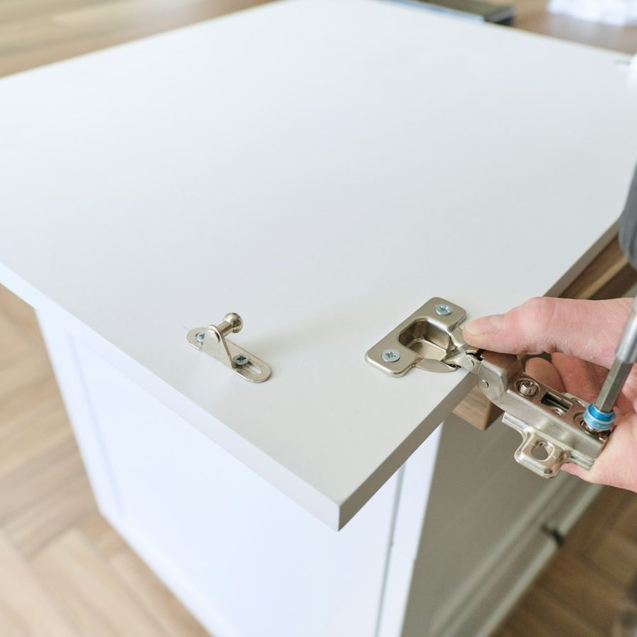 Closeup of furniture assembly with professional tools.